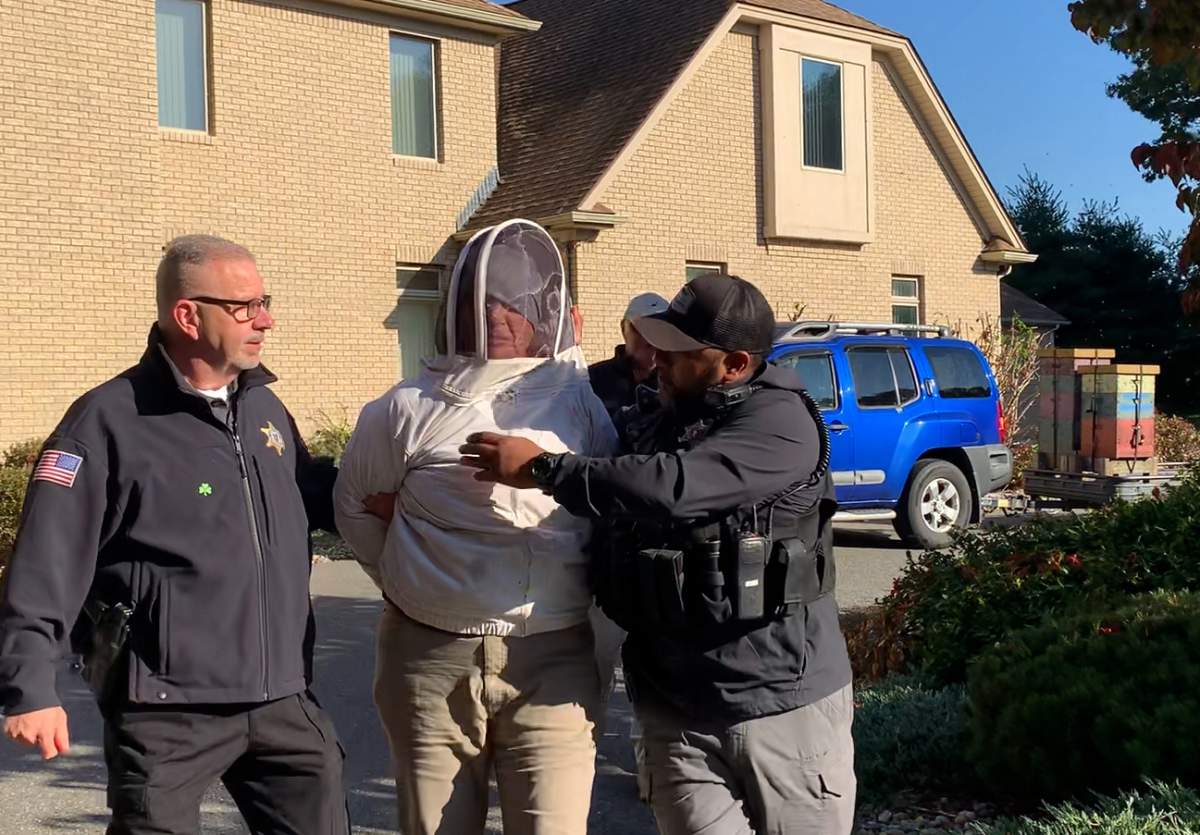 Rorie S. Woods wearing a beekeeper suit after being arrested by the Hampden County Sheriff's Department.