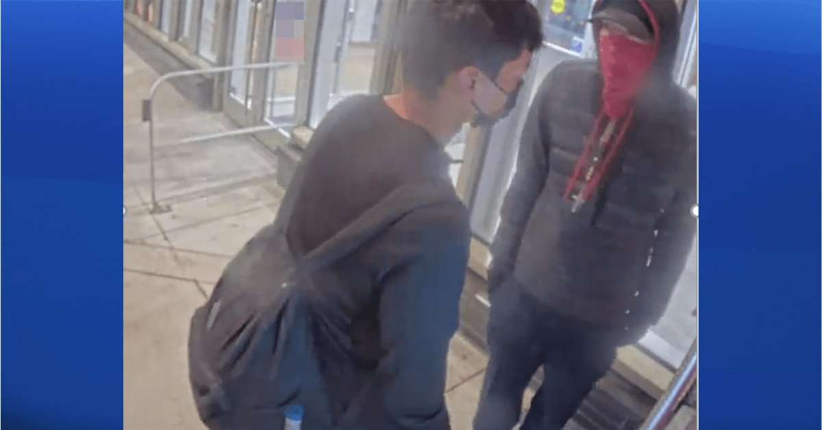 Calgary police are turning to the public to help identify a person of interest — the one wearing the red bandana — surrounding the death of a man in East Village on Oct. 25, 2022.