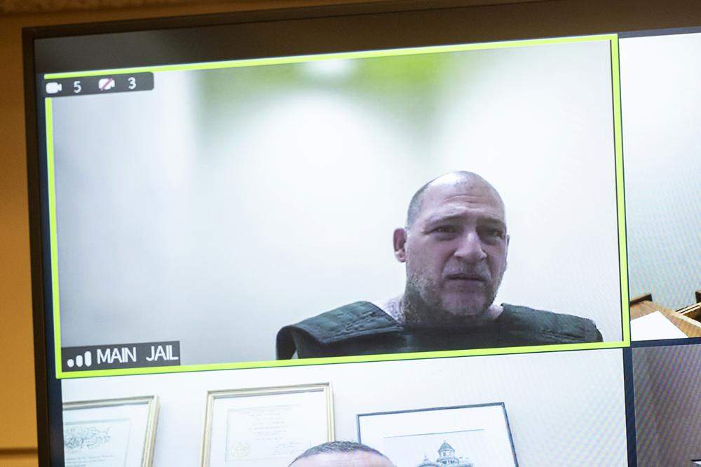 Jesus Salgado appears in court via video. He is wearing a protective vest.