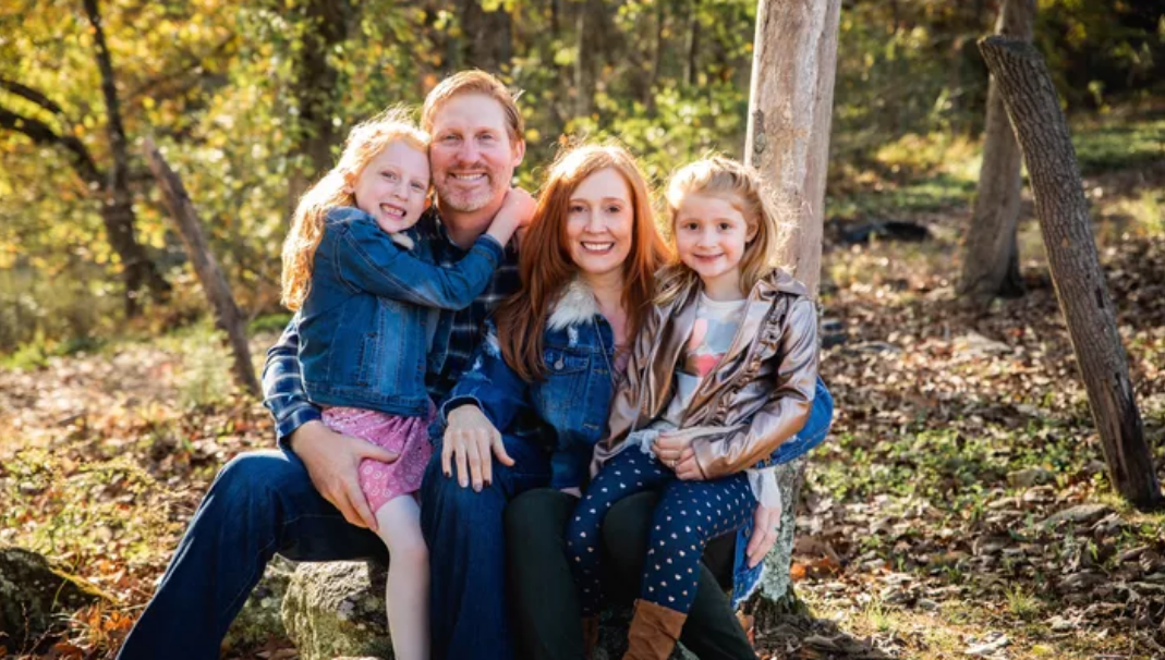 Phil Paxson with his two daughters and wife.