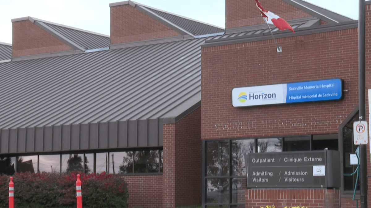 A Canadian flag waves at the entrance of Sackville Memorial Hospital