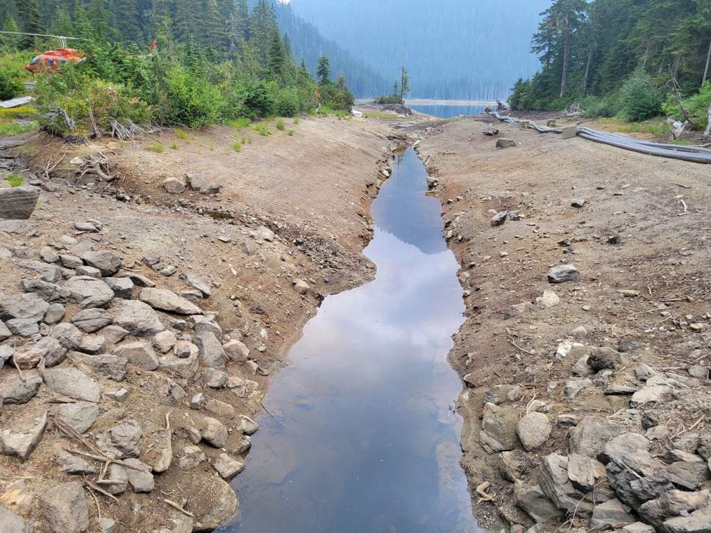 A parched irrigation channel is unable to supply enough water to the Sunshine Coast, so crews have to siphon the water from the middle of the lake using helicopters.