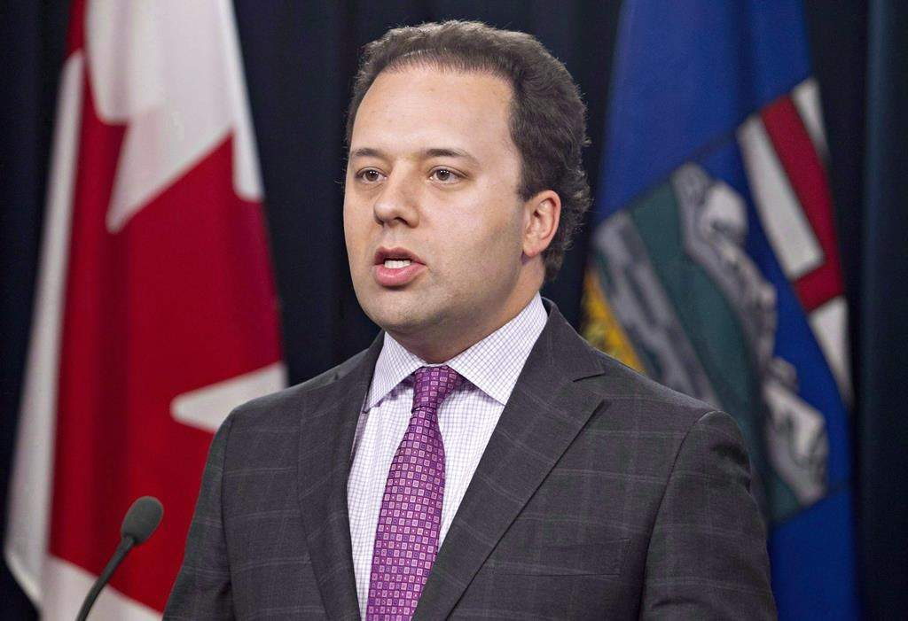 Alberta Justice Minister Jonathan Denis attends a news conference in Edmonton on Thursday Aug 7, 2014. Denis is being accused of professional misconduct, according to the Law Society of Alberta. THE CANADIAN PRESS/Jason Franson.