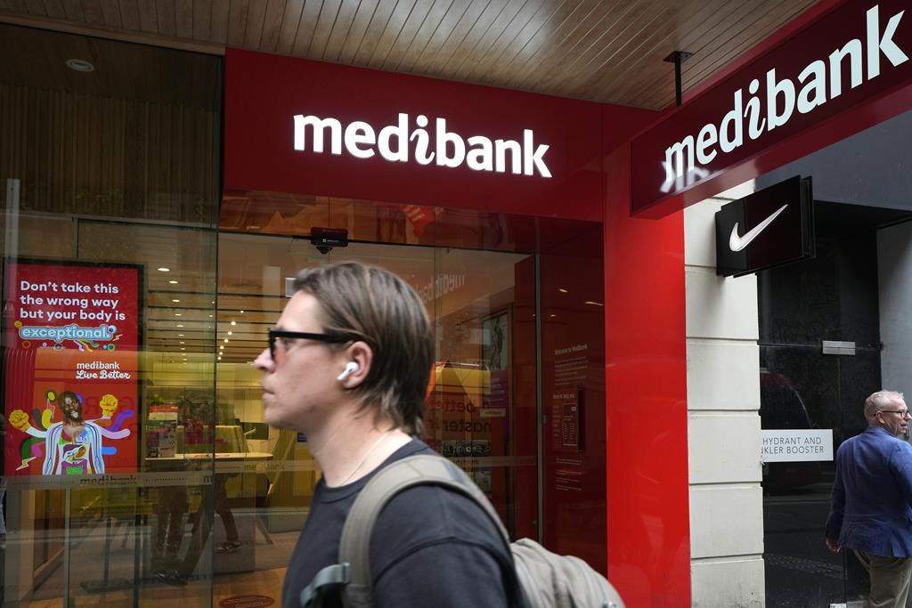 Person walks past a Medibank office in Sydney, Australia