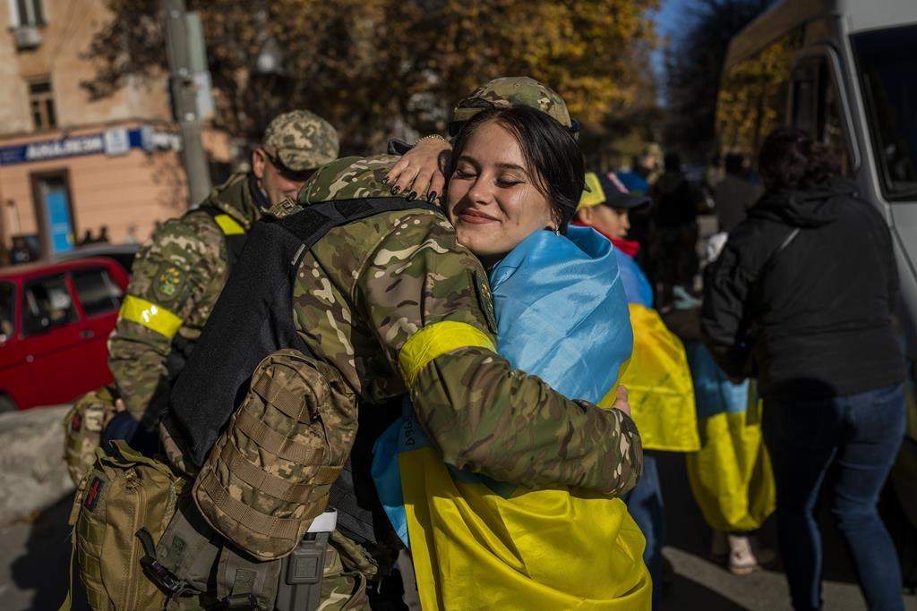 Kherson resident hugs Ukrainian defence force member in Kherson, southern Ukraine, Monday, Nov. 14, 2022. The retaking of Kherson was one of Ukraine’s biggest successes since Moscow’s invasion. (AP Photo/Bernat Armangue)