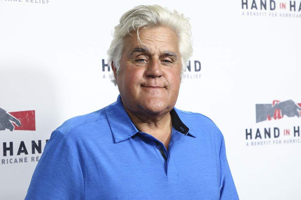Jay Leno in a blue shirt.