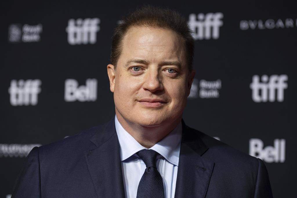 Brendan Fraser in a black suit.