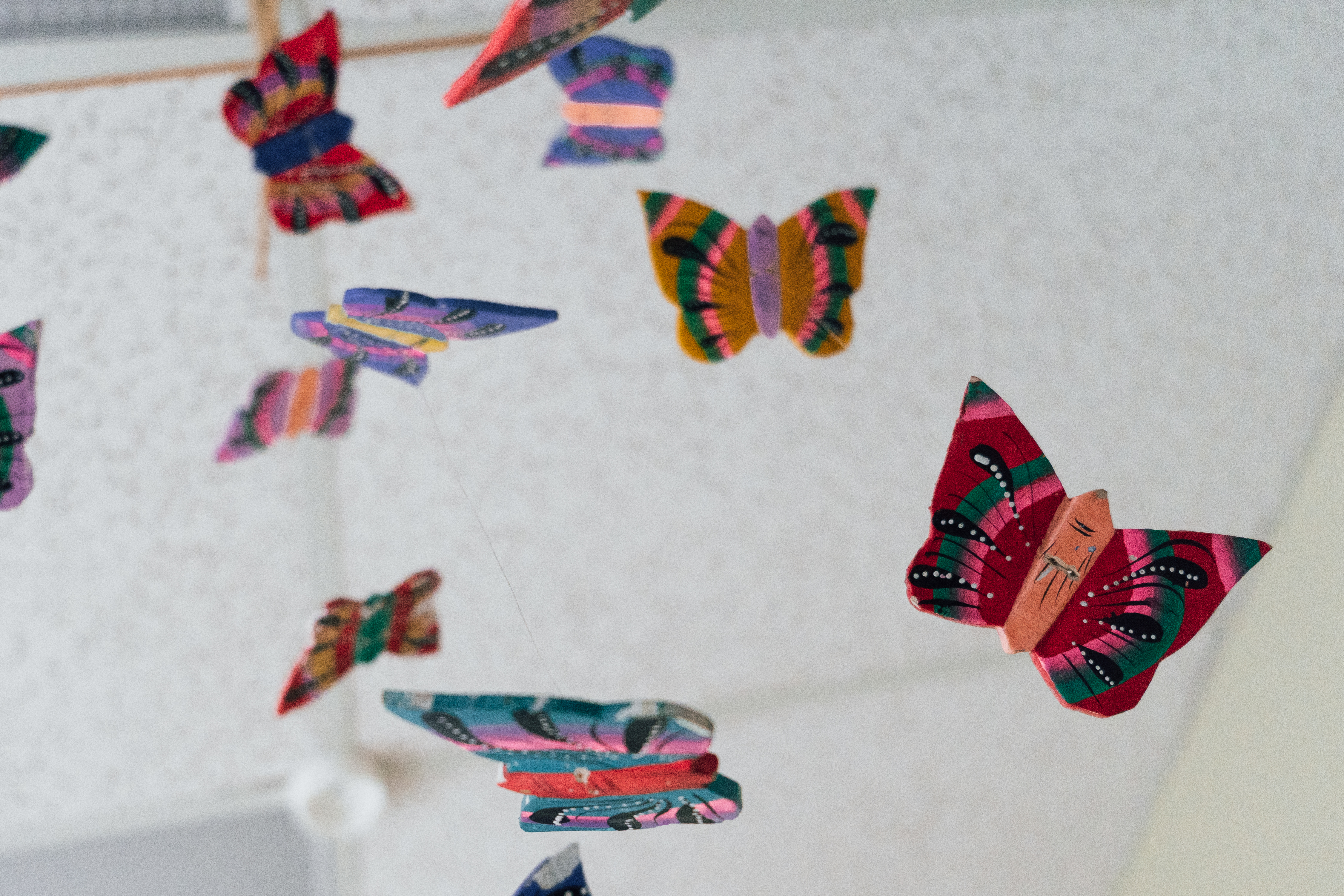 A photo of a colourful butterfly mobile that hangs from the ceiling of an Ontario abortion clinic