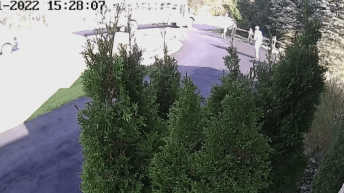 A screenshot from the home surveillance footage that captured the moment Derek Tappen's 5-year-old son was dragged by the bus on Nov. 1, 2022.