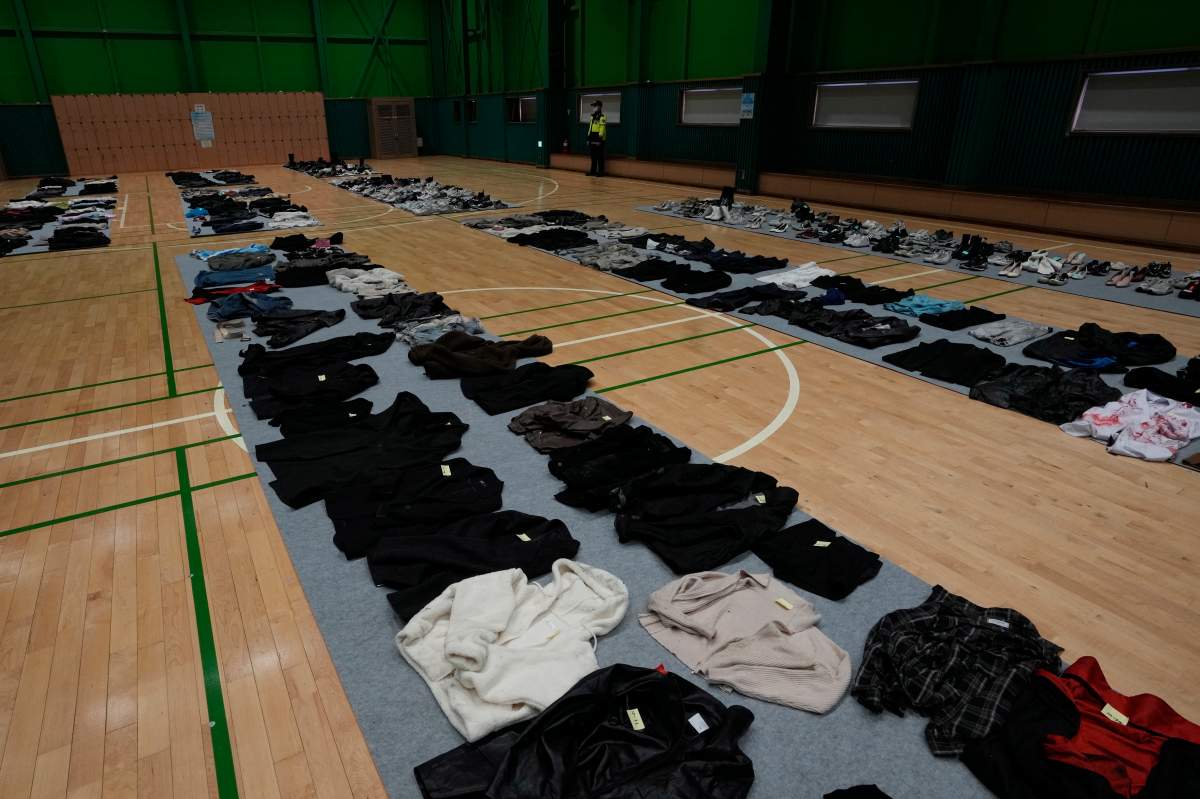 Clothes collected from the scene of a deadly accident following Saturday night's Halloween festivities, are placed at a temporary lost and found center at a gym in Seoul, South Korea, Tuesday, Nov. 1, 2022.