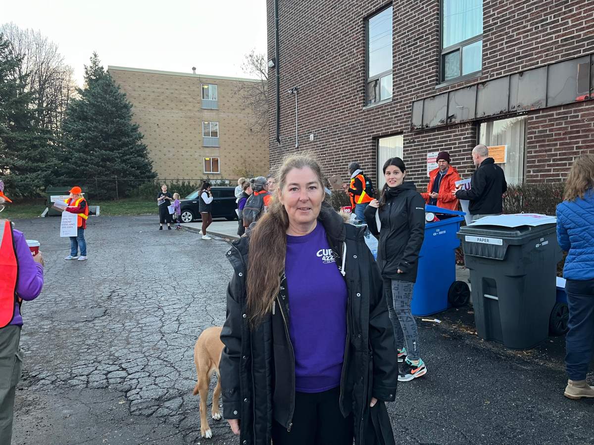 Mary Henry, president of CUPE 4222, walking the picket line outside NDP MPP Peggy Sattler’s office at 240 Commissioners Rd. W. on Friday.