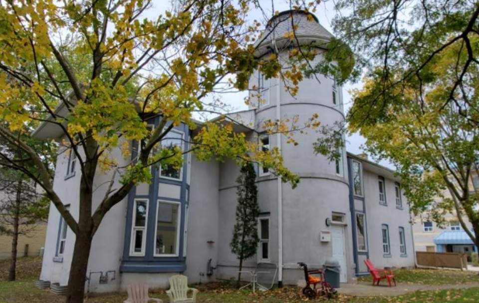 A two-storey building with a tower in Guelph.
