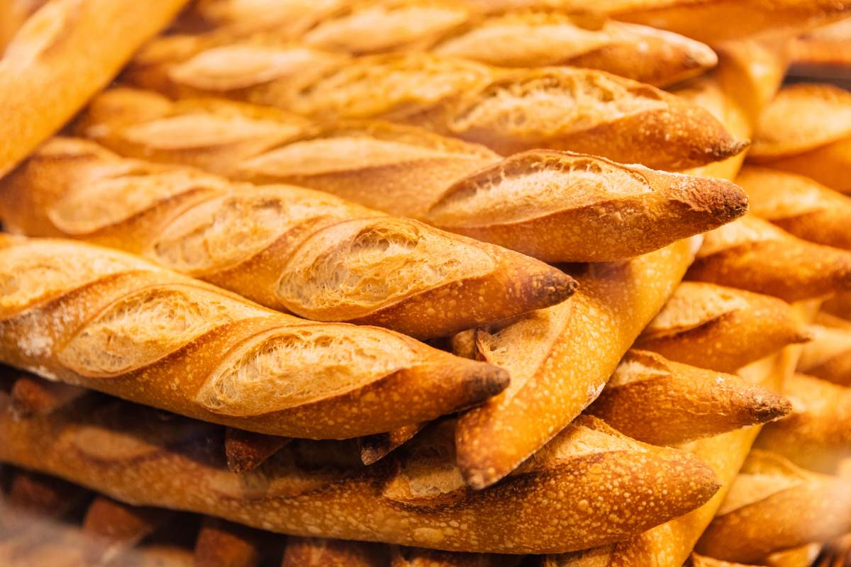Fresh baguettes for sale at the bakery, close-up view
