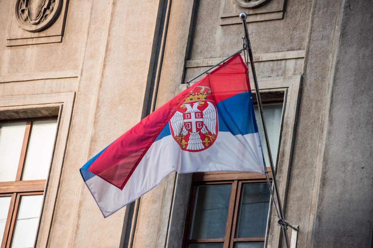 Low angle view of a Serbian flag on a building in Belgrade. The Serbian soccer federation was charged by FIFA on Saturday for hanging a political banner about neighboring independent state Kosovo in the locker room before playing Brazil at the World Cup.