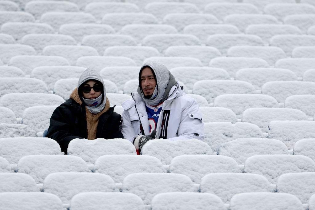 FILE - Buffalo Bills fans look on from snow covered seat prior to the game against the Atlanta Falcons at Highmark Stadium on January 02, 2022 in Orchard Park, New York.