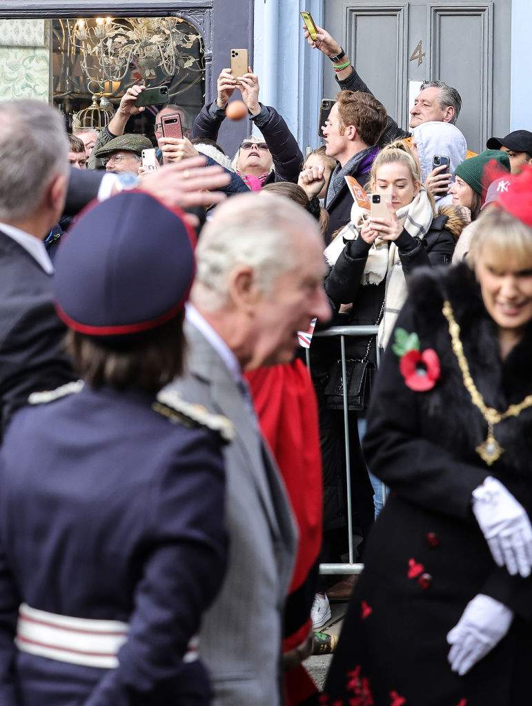 An egg is thrown by a member of the public, seen just above King Charles III’s head, as he and Camilla, Queen Consort arrive for the Welcoming Ceremony to the City of York at Micklegate Bar during an official visit to Yorkshire on Nov. 09, 2022 in York, England.