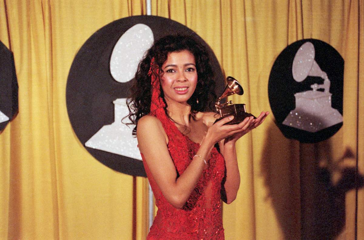 Irene Cara, best known as a singer of movie themes, holds her award for the song "What a Feeling" from the movie "Flashdance."
