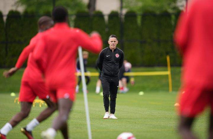 Canadian national men’s soccer team head coach John Herdman watches a training session for a CONCACAF Nations League match against Curacao, in Vancouver, on Tuesday, June 7, 2022.