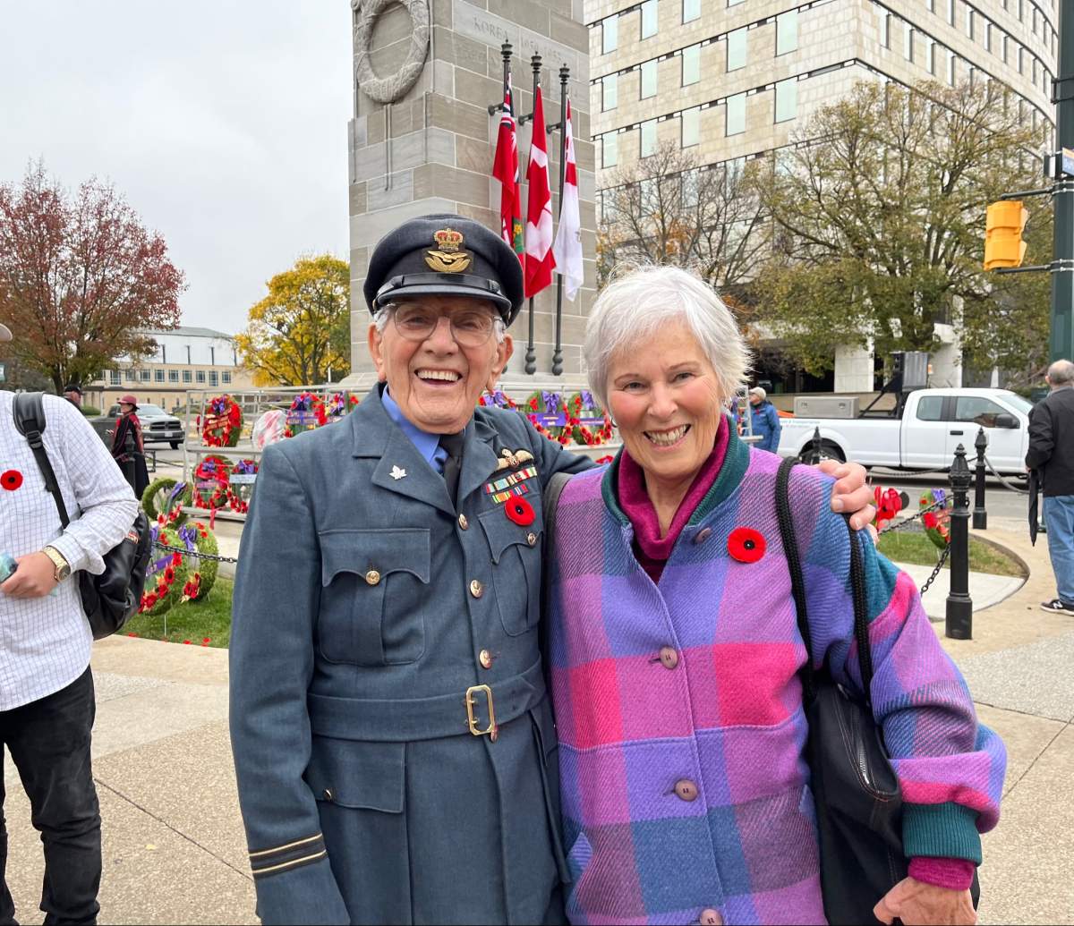 London's honorary veteran Tom Hennessy stands alongside his wife Joyce Hetherington in front of the Cenotaph in Victoria Park.
