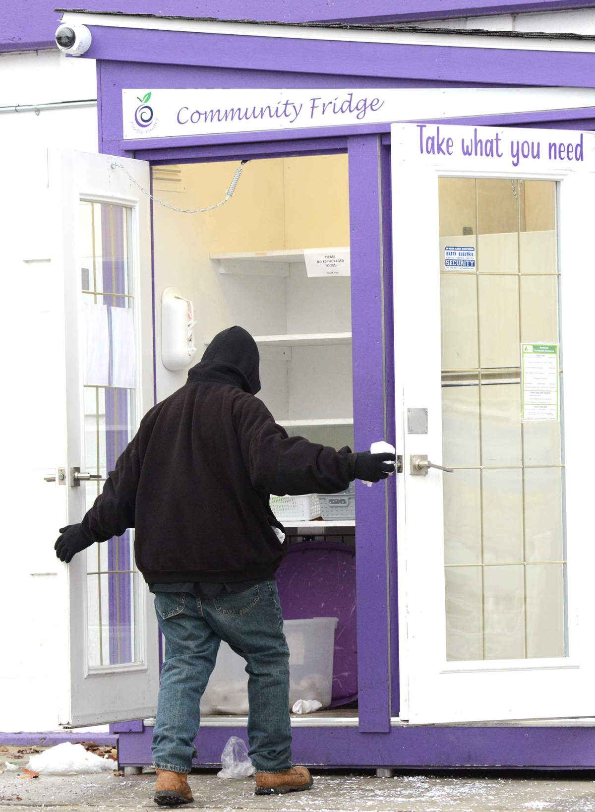 A person in need goes the Penticton Community Fridge and Pantry on Ellis Street to get some food. Mark Brett/Local Journalism Initiative