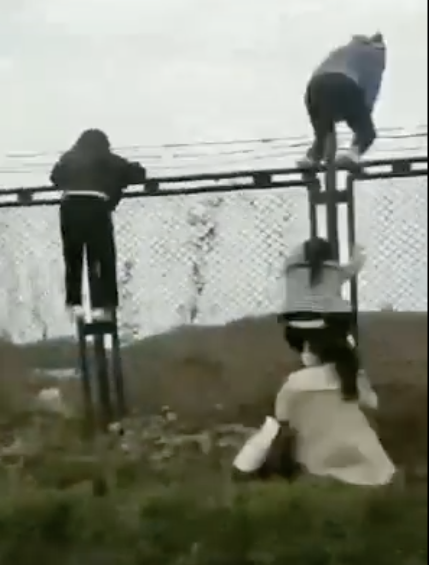 Screengrab of a video posted to Twitter by the BBC's China correspondent appearing to show workers escaping an iPhone factory in Zhengzhou amid a COVID-19 lockdown.