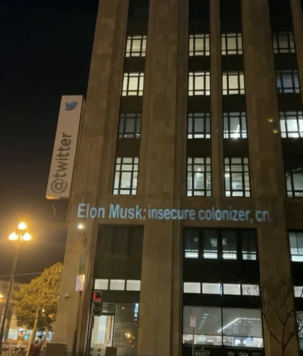 Screenshot from Twitter user Joshua P Hill, who says he shot this video Thursday night of insults aimed at Elon Musk being projected on Twitter's headquarters.