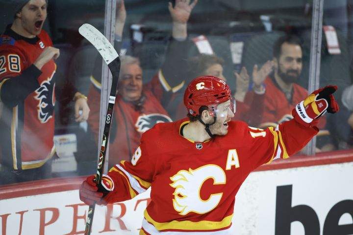 Calgary Flames’ Matthew Tkachuk celebrates his goal during first period NHL hockey action against the Seattle Kraken in Calgary, Saturday, Feb. 19, 2022.