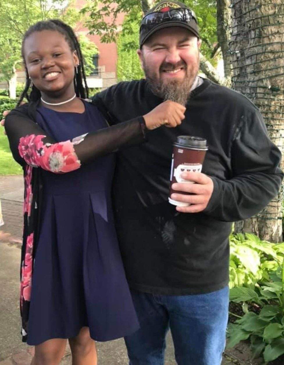 Aidaen with her father, Scott Mitchell, during her Grade 8 graduation.