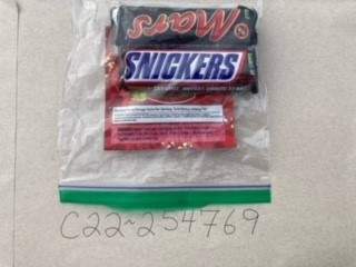 The cannabis edibles were packaged in ziploc bags alongside full-sized candy bars.