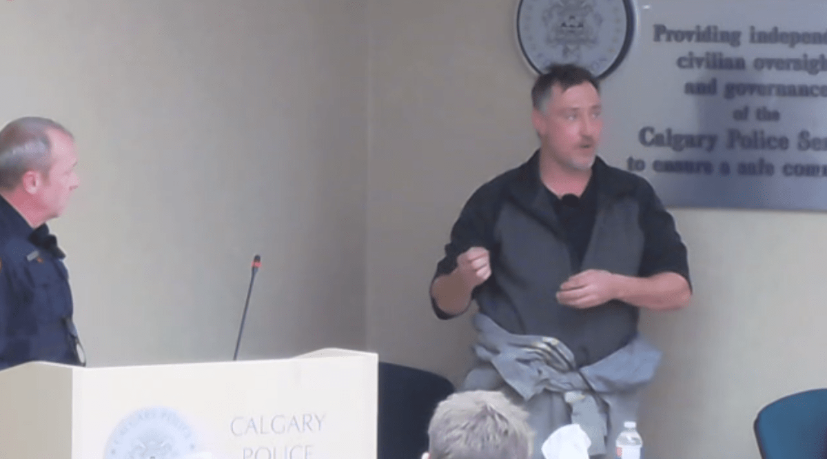 Eric Clinton (R) speaks to the Calgary Police Commission on Nov. 30, 2022, about his experience through drug courts.