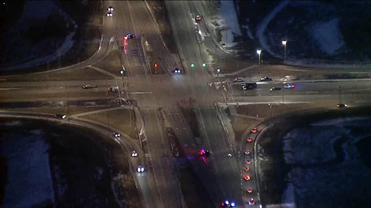 Calgary police closed off the intersection of Métis Trail and Airport Trail on Nov. 25, 2022 after a two vehicle crash sent two to hospital.