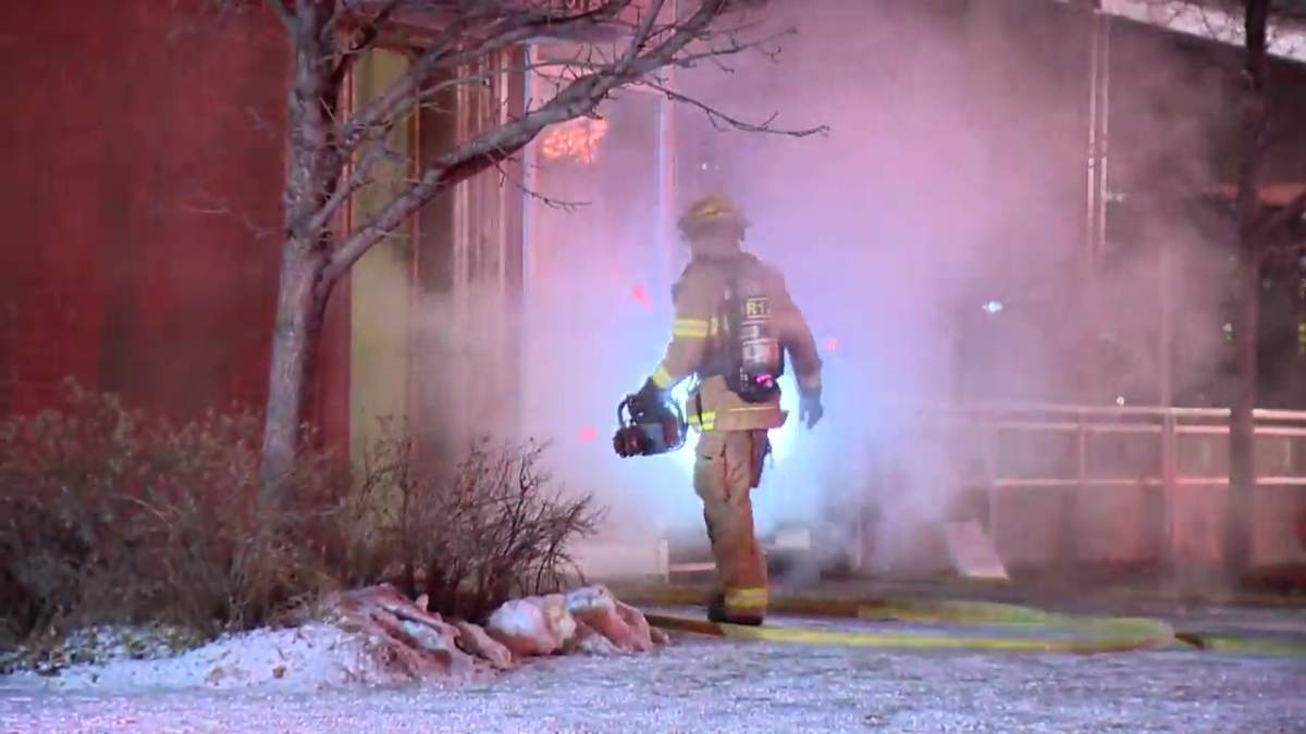 Calgary firefighters work to put out a fire at the Bridgeland Riverside Community Association on Nov. 28, 2022.