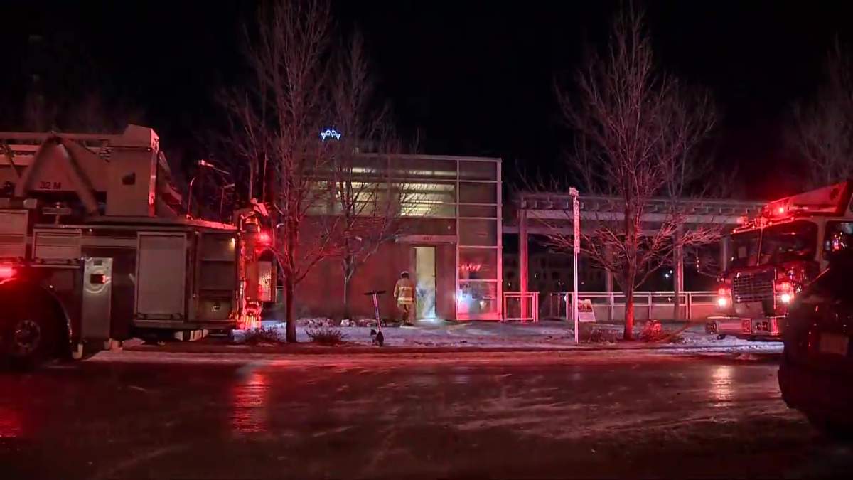 Calgary firefighters work to put out a fire at the Bridgeland Riverside Community Association on Nov. 28, 2022.