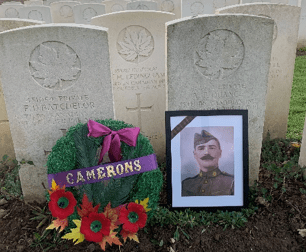 A photo and wreath at the newly rededicated headstone for Corporal George Herbert Ledingham.