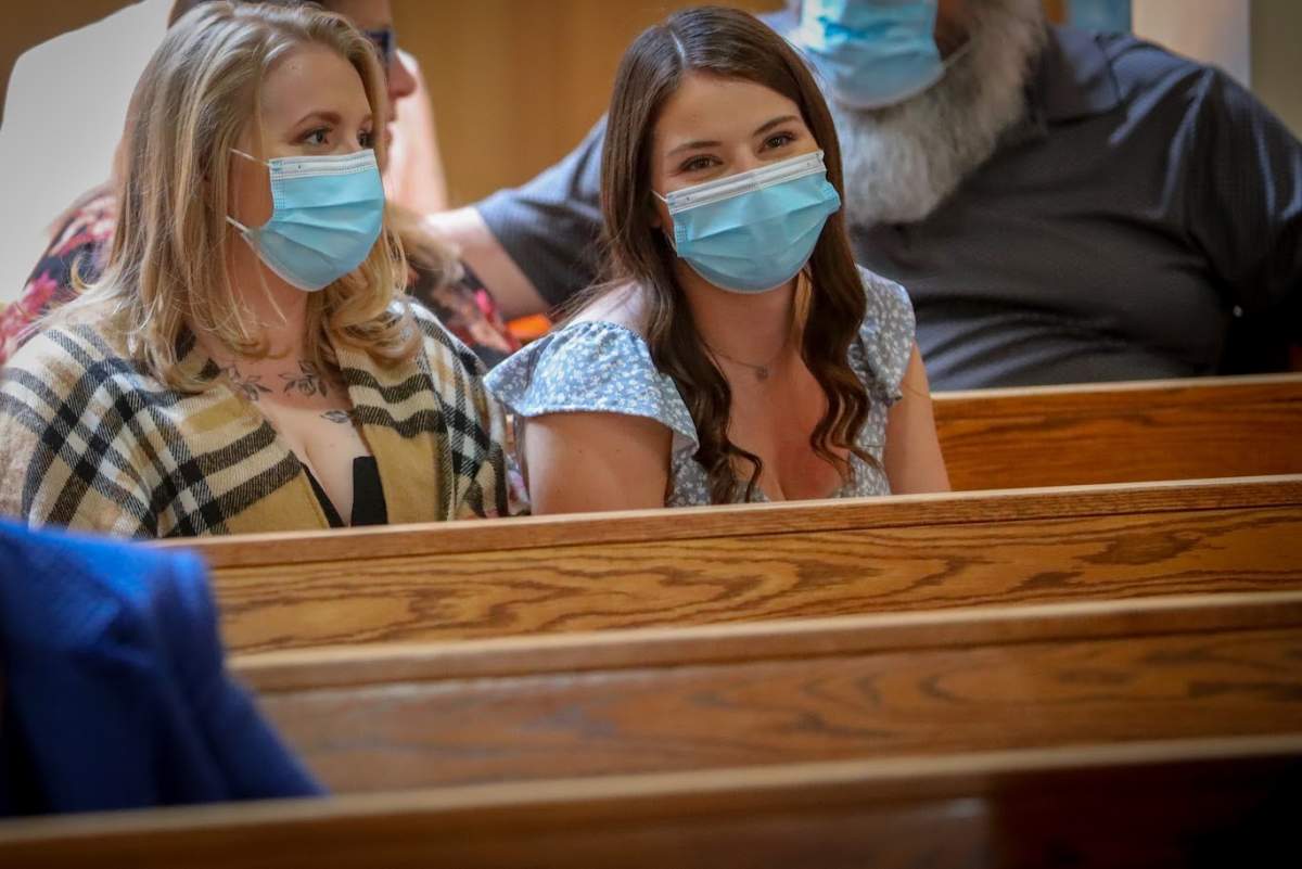 CALGARY — Katrina Cameron, primary care paramedic, left, and Atlanta Evis, advanced care paramedic, right, attend the wedding of former patient Marvel in Calgary.