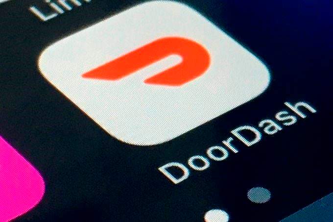 In this Feb. 27, 2020, file photo, the DoorDash app is shown on a smartphone in New York. 