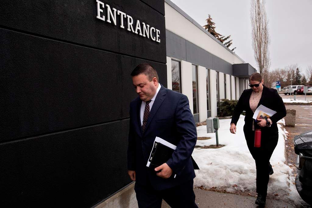 Cpl. Randy Stenger, left, and Const. Jessica Brown, return to court to resume their jury trial on charges of manslaughter with a firearm and aggravated assault, in Edmonton on Friday, Nov. 25, 2022.