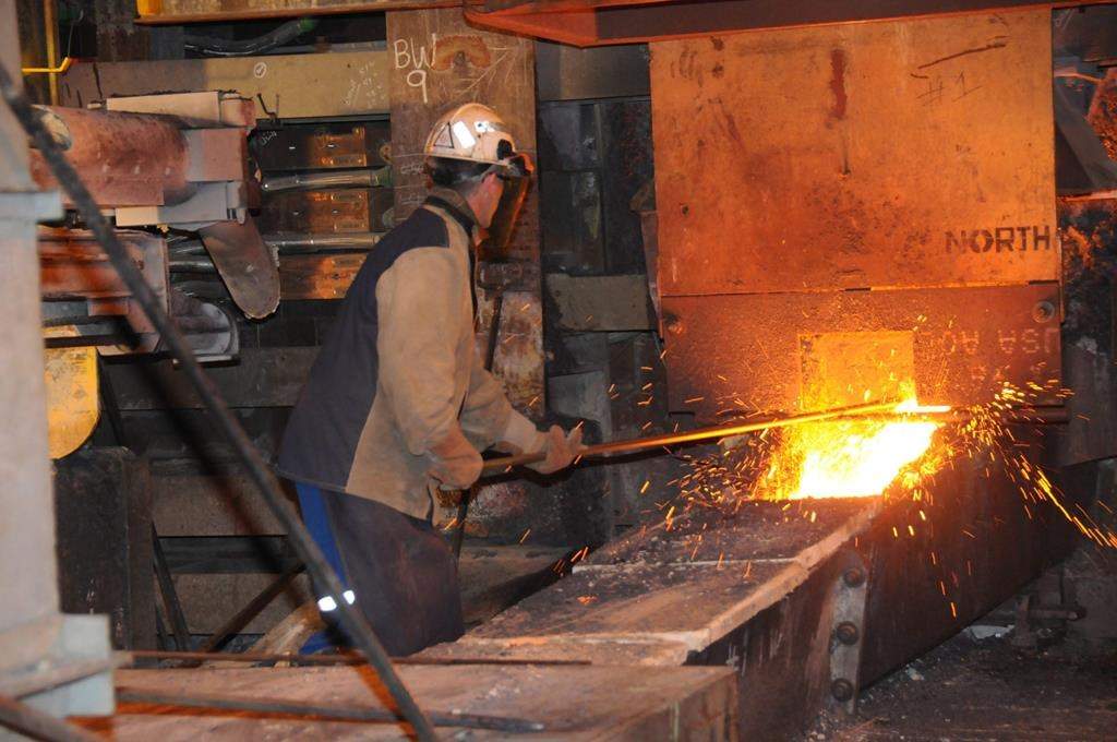 A tapper tapps nickel-copper matt in the flash furnace of Vale SA smelter complex in Copper Cliff, Ont. in this file photo.