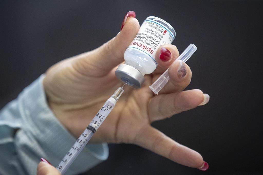 A person draws out a vaccine in Kingston, Ont., on Sunday Jan. 2, 2022.