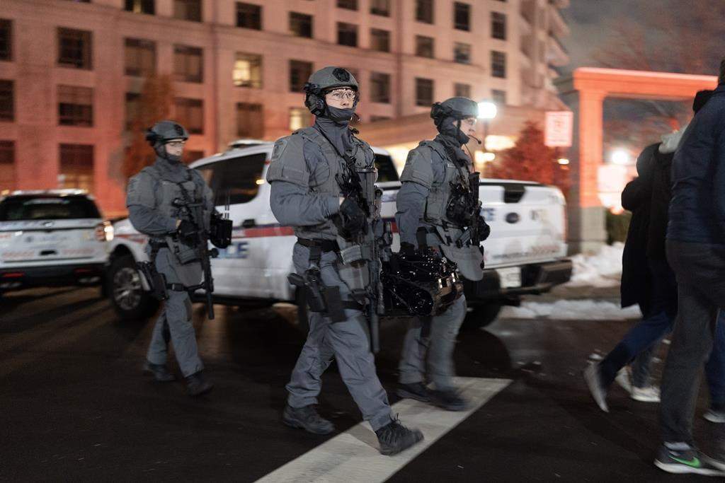 York Regional Police tactical officers attend the scene of a shooting at a condo building in Vaughan, Ont., Sunday, Dec. 18, 2022.