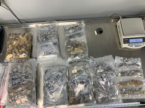 Police said they also found $11,000 in coins.
