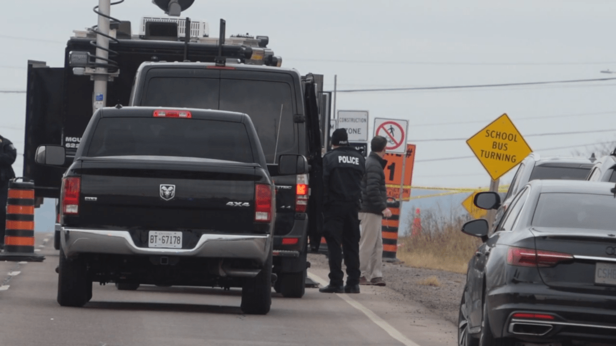 Halton Police on scene at Dundas Street and Tremaine Road in Burlington on Nov. 27, 2022. Investigators say a vehicle fire and death in the area appeared to be suspicious.