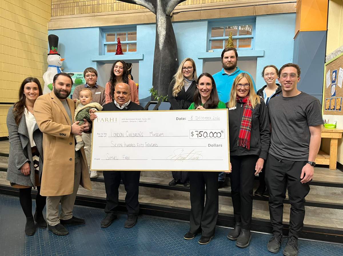Officials with Farhi Holdings Corporation and London Children's Museum pose with a $750,000 cheque on Thursday.