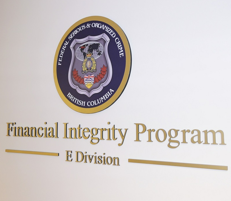The B.C. RCMP's Federal Serious and Organized Crime Financial Integrity unit seized drugs, guns, cash, gold bars, cars, and more, after searching two properties in White Rock and Surrey on Nov. 30, 2022.