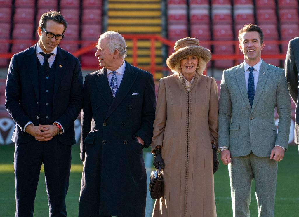 King Charles III and Camilla, Queen Consort meet with Co-Owners of Wrexham AFC, Ryan Reynolds and Rob McElhenney during their visit to Wrexham Association Football Club (AFC) on December 9, 2022 in Wrexham, Wales.