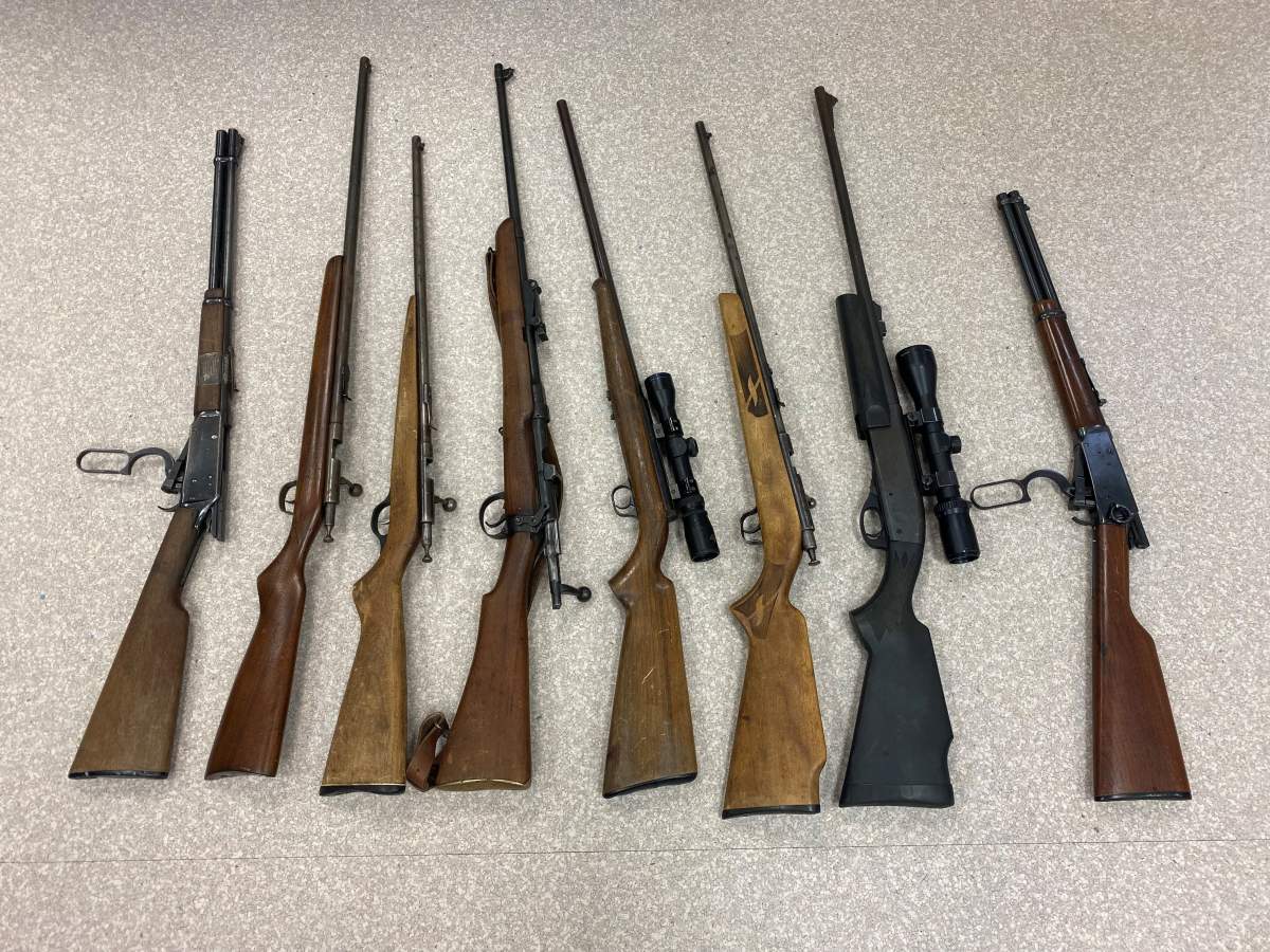 Stolen firearms found hidden in the snow along Highway 165.