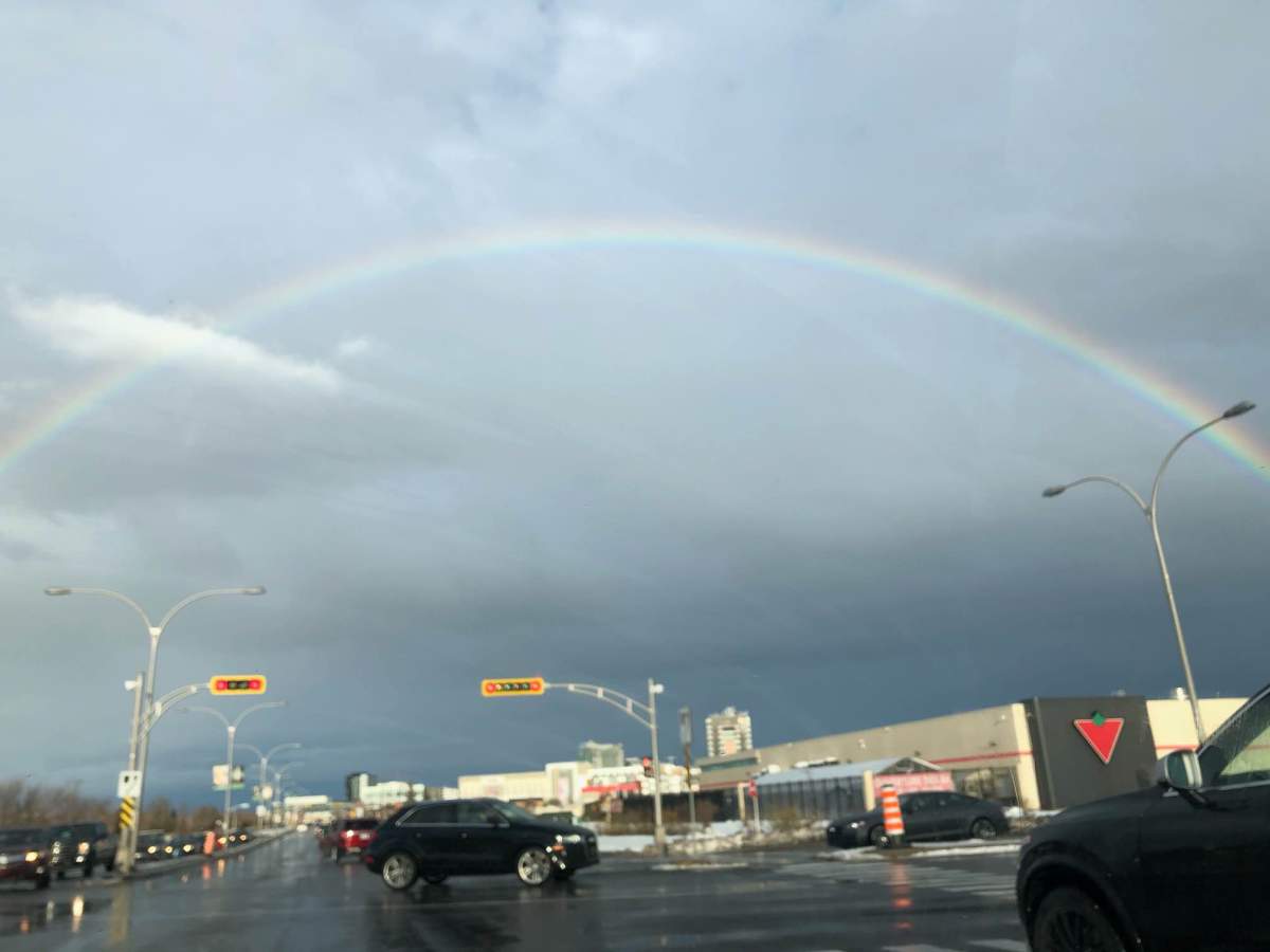 A rainbow appears Friday afternoon Dec. 23, 2022 on Montreal’s south shore during a winter storm.