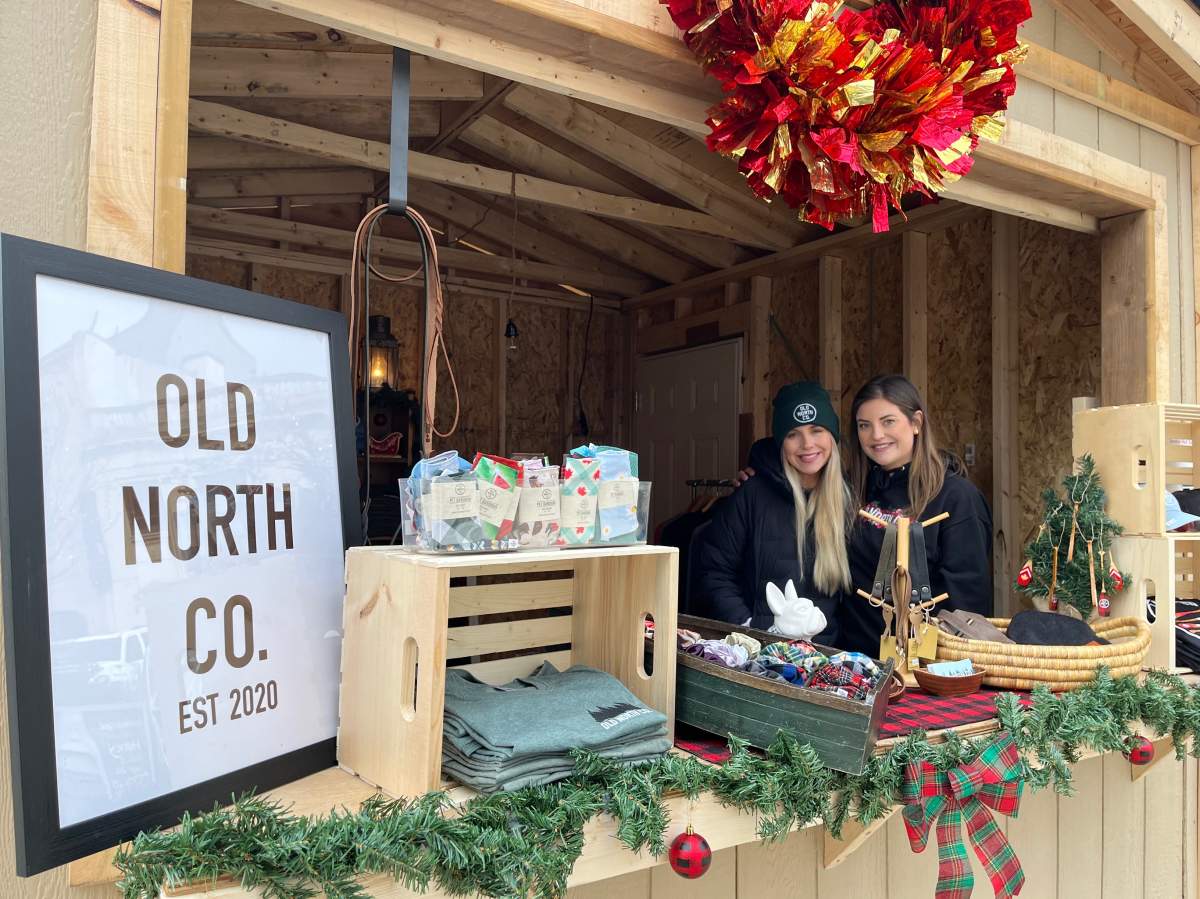 Sisters McKenzie (left) and Mallory Kemp have plenty of goods to keep folks warm at the Holly Jolly Market.