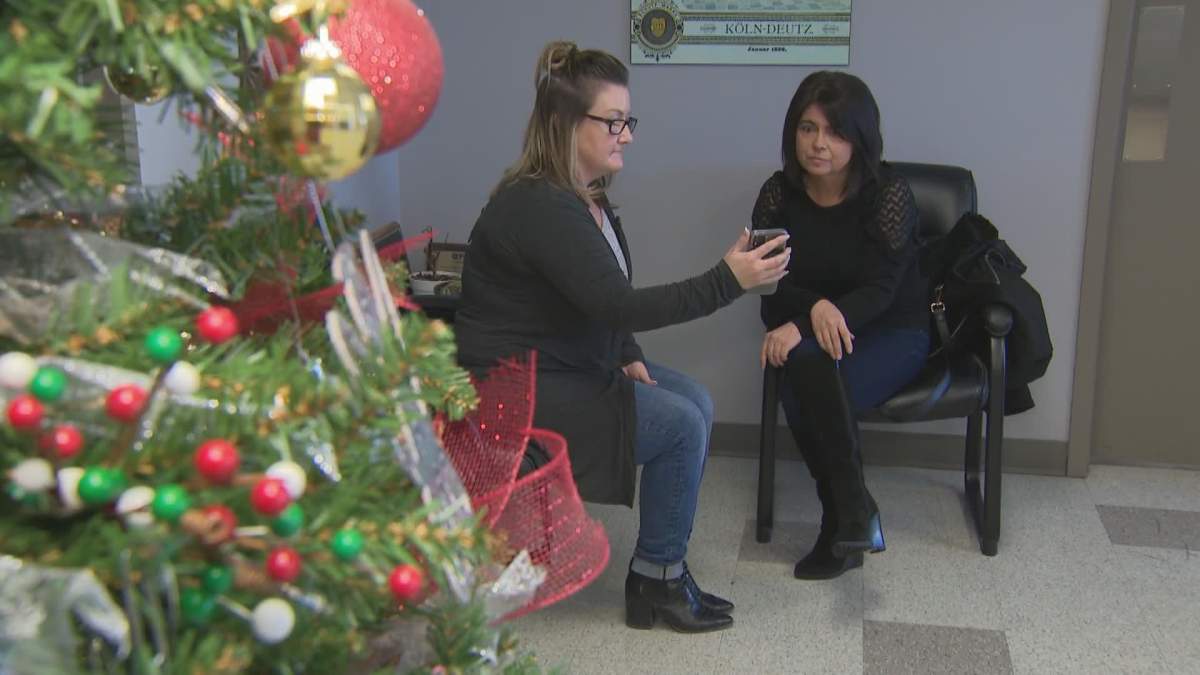 Tammy Johnson shows Global News the video of porch pirates making off with her package