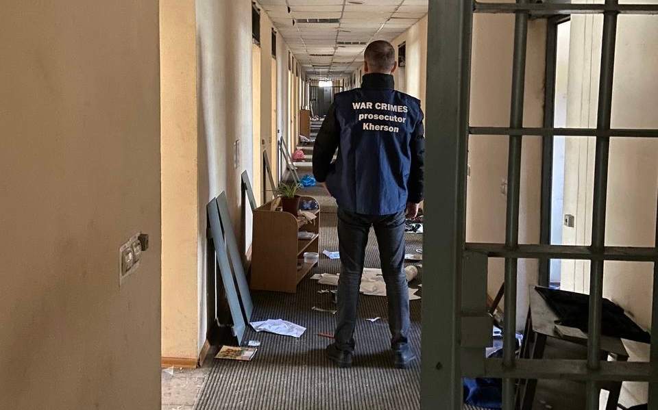 Ukrainian war crimes investigator at building in Kherson used by Russian forces as a torture centre.
